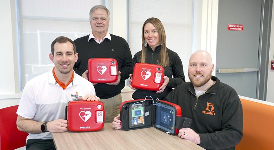 Tyson Depinet, Bob Fruth, Janelle Baldosser, Jake McGraw with new AEDs
