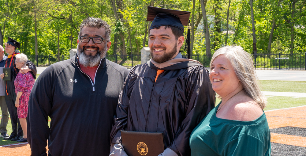 Student with Parents at Graduation