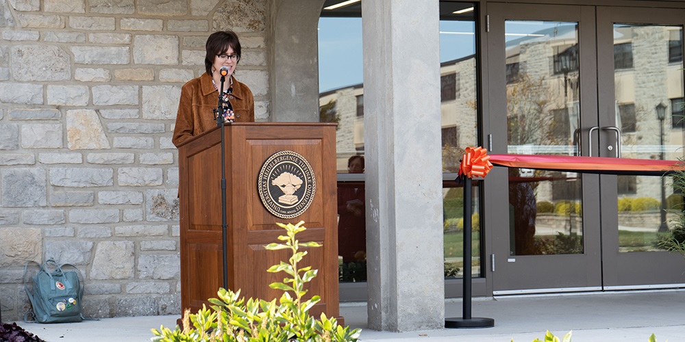 "Sophomore Miller Hall resident Audrey Warren speaks during the dedication ceremony.