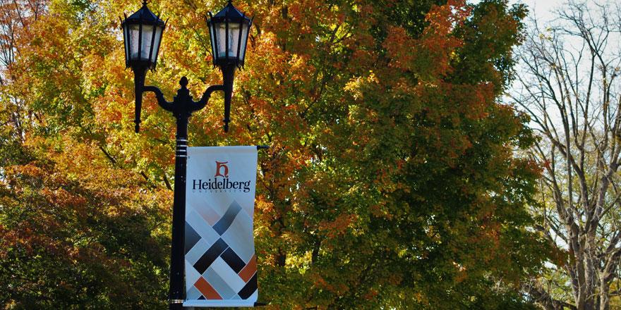 Pole banner pictured with fall background