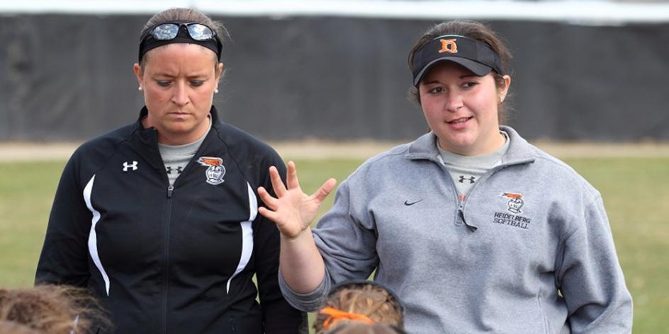 Former coach Betsy Hada and standout first-baseman (now coach) Bessie (Artino) Guy together in 2015.