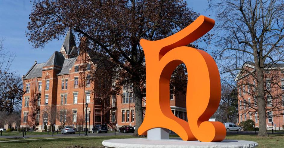 Campus H sculpture stands in front of University Hall