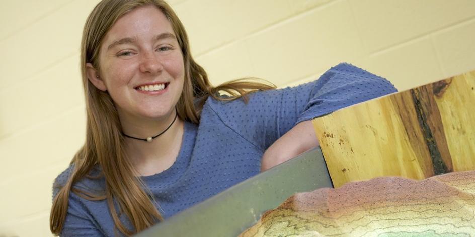 Senior Honors student Kelly Spence with her Augmented Reality Sandbox research project.
