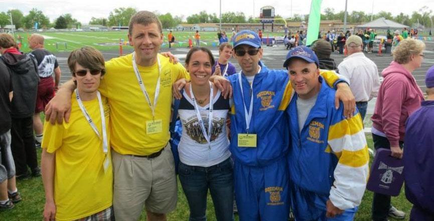 Mandy pictured in between four Special Olympic athletes