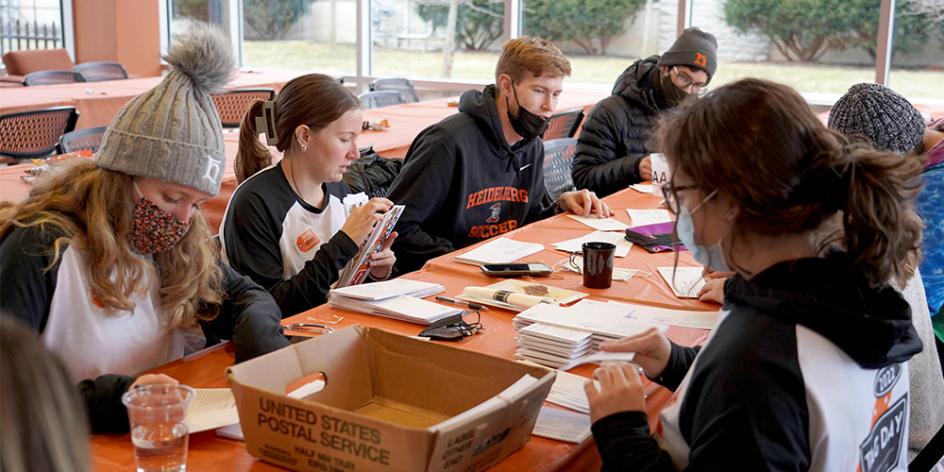 Students sign thank-you letters to donors during the 10th annual TAG Day.