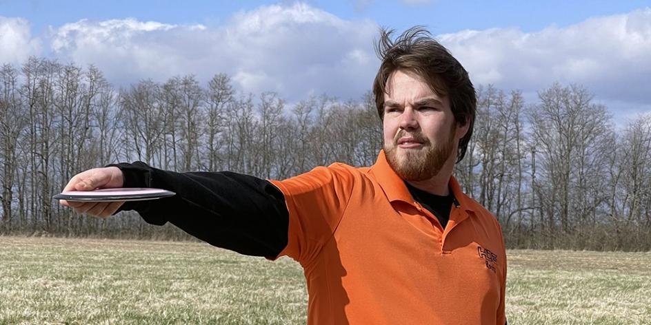 Rocky Hurst lets a disc fly during a recent disc golf tournament.