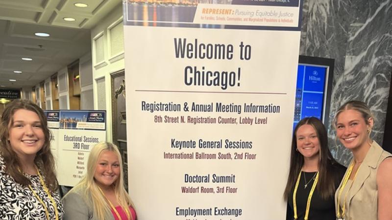 Lazzari & students at Chicago conference