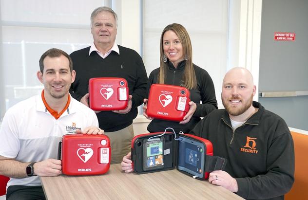 Tyson Depinet, Bob Fruth, Janelle Baldosser, Jake McGraw with new AEDs
