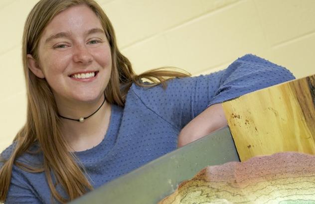 Senior Honors student Kelly Spence with her Augmented Reality Sandbox research project.