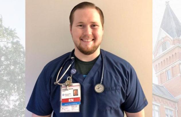 Tyler Hunter posing for photo in scrubs