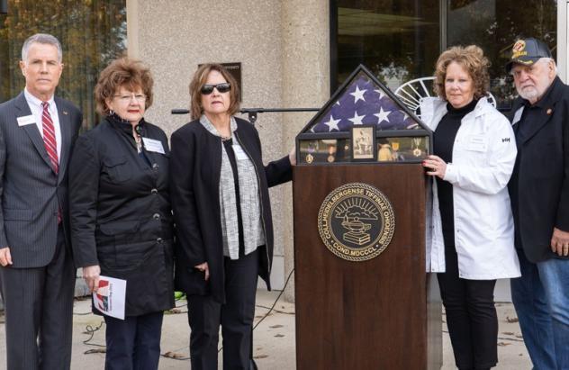 The family of Jim Tangeman '67 presented to Heidelberg the flag that draped his coffin and his Vietnam service medals.