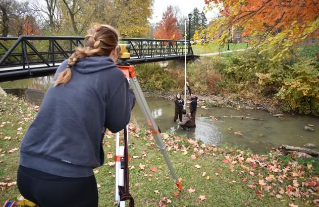 students working in creek