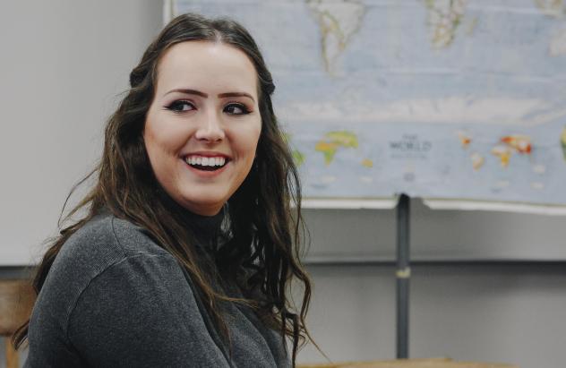 student smiling in class