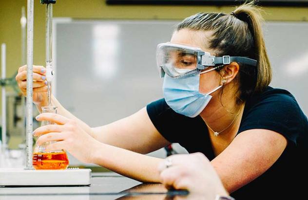 student works in lab