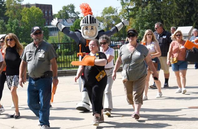 Families & Benefactors make their way to the football game after a tailgate lunch.