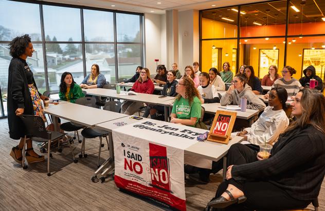 Dr. Jen Fry speaks to class