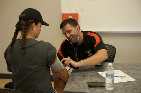 staff giving physicals